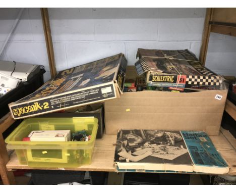 Shelf of various vintage board games, die cast cars etc