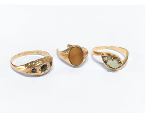 Two 9ct gold dress rings, total weight 3.2g and a yellow metal dress ring