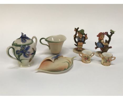 Three pieces of Franz porcelain, two Hummel figures and two Royal Worcester miniature tygs