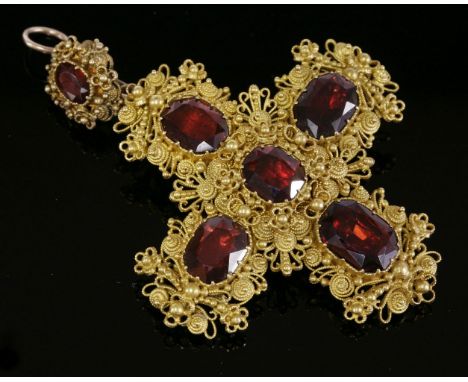 A garnet, gold cannetille cross brooch/pendant, c.1835,with graduated octagonal garnets, claw set to the centre and each arm.
