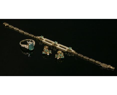 A Continental gold, emerald and diamond ring, bracelet and earring matched suite,the ring with an emerald cut emerald, end se