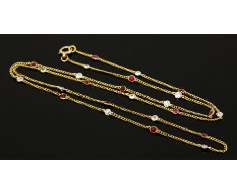 A ruby and diamond set gold chain, early 20th century,with alternating old European cut diamonds and circular and oval mixed 