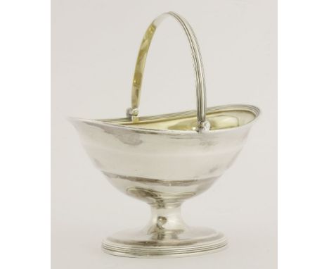 A George III silver swing-handled sugar basket,by Henry Chawner, London 1794,of shaped oval form on pedestal oval foot, with 