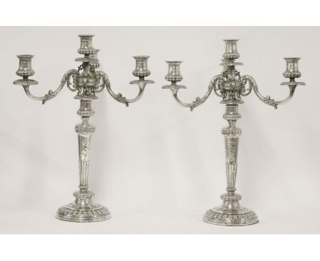 A pair of George III silver four-light candelabra,by John Roberts & Co., Sheffield 1808,the half fluted tapering baluster ste