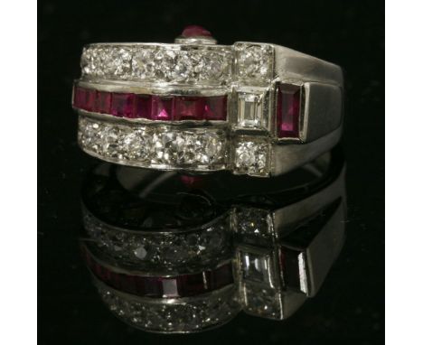 An Art Deco, Odeonesque, ruby and diamond ring, c.1935,an arched section to one side, channel set with a central row of calib