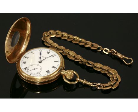 A 9ct gold half hunter pocket watch by J W Benson,with black Roman numeral chapter ring to the front cover.  The case 49mm di