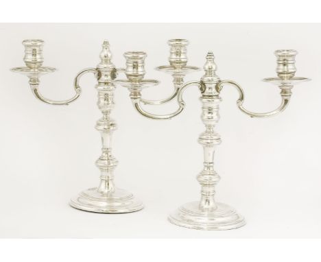 A pair of silver two-light candelabra,by William Comyns & Sons Ltd., the branches London 1962, the candlesticks London 1965,i