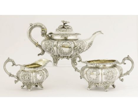 A Victorian silver three-piece tea set, probably by William Hunter, London 1838,of melon shape on four foliate bracket suppor