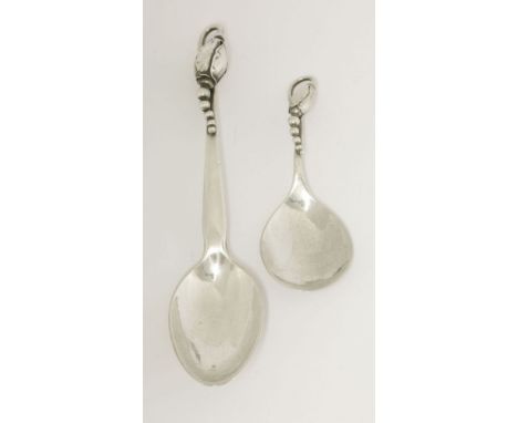 Two Georg Jensen silver ‘Blossom’ pattern spoons,comprising:a caddy spoon,import hallmarked 1927, design no. 84,10cm long, an
