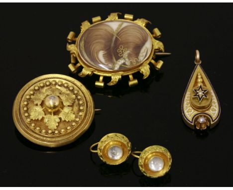 A Victorian gold memorial brooch/pendant,with a landscape, central oval glazed panel with coiled hair below, paper scroll out