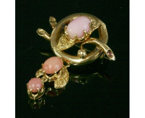 A Victorian conch pearl and coral gold brooch, c.1870,with a polished hoop top with a branch through the centre.  An oval lig