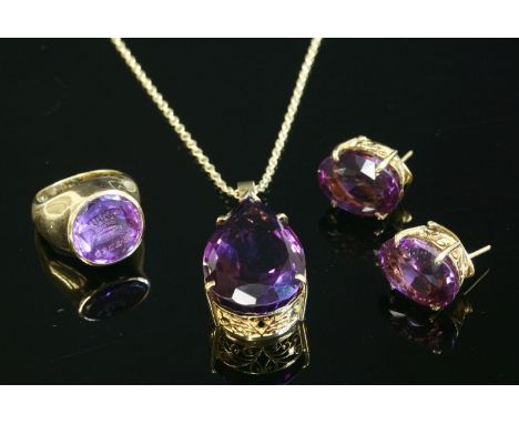 An amethyst pendant, earrings and ring matched suite,with the pendant composed of a pear cut amethyst, claw set pierced folia