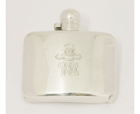 A silver spirit flask,by Stokes & Ireland Ltd., Chester 1914,of curved oblong form, engraved with crest, motto and monogramme