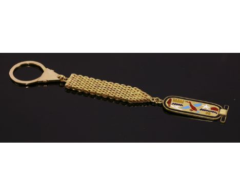 A cased Egyptian gold and enamel key ring,with a three-colour gold panther link chain with bark textured finish.  A cartouche