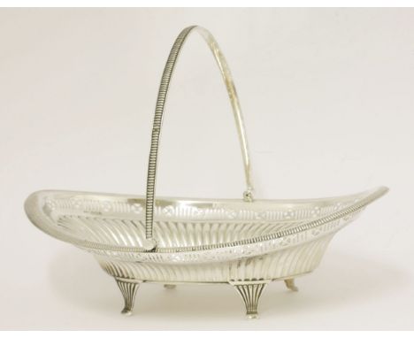 A Victorian silver swing-handled cake basket,by John Howson, Sheffield 1896,of fluted oval form with pierced frieze above, on