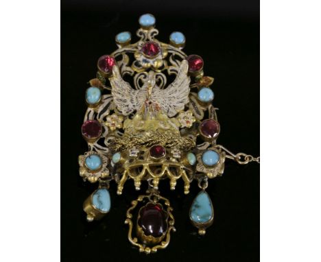 An Austro-Hungarian gem set and enamel silver gilt brooch,with an enamelled swan on its nest to the centre.  A pierced scroll