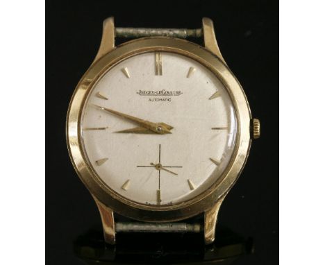 A gentlemen's 9ct gold Jaeger-LeCoultre automatic strap watch, c.1960,silvered dial, gilt pennant batons, sword hands and sub