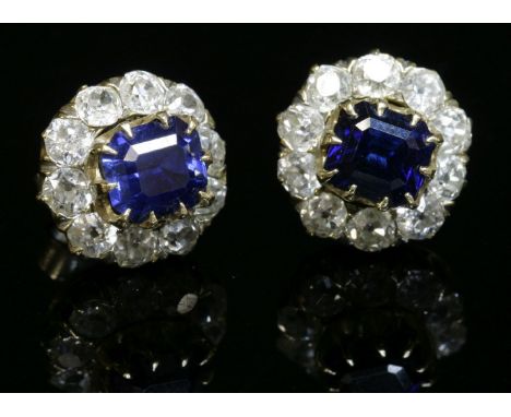 A pair of Victorian sapphire and diamond cluster earrings,with an emerald cut sapphire, claw set to the centre.  Surrounded b