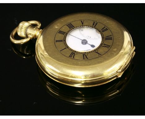 An 18ct gold half hunter pocket watch,with a black enamel Roman numeral chapter ring to the front cover.  The case 48mm diame