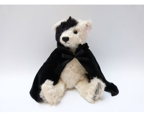 Steiff Original musical 'Phantom of the Opera' 662164 teddy bear, with white and black mohair, button to ear, tags and certif