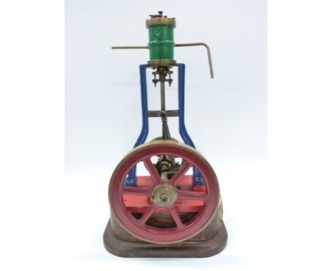 Live steam vertical 'A' frame steam engine mounted on wooden base with spoked drive pulley, marked Riches & Watts Co to the b