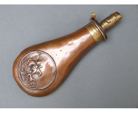 James Dixon & Sons copper and brass powder flask with embossed decoration of a man carrying a dead stag on a horse with his d