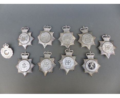 Ten police helmet badges including Devon Constabulary, Humberside, South Yorkshire, Denbighshire, Herefordshire, Mid-Wales et