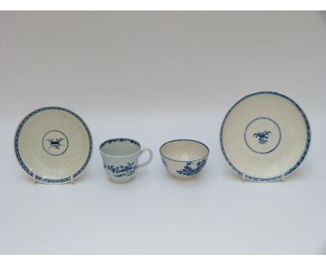 Two first period Worcester saucers, a tea cup and tea bowl