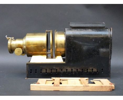 A brass and painted steel 19thC magic lantern by JW London, established 1816, marked to front 6in