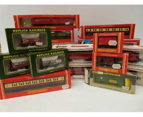 Twenty one Hornby, Wrenn, Bachmann, Lima and Replica Railways 00 gauge carriages and wagons, all in original boxes