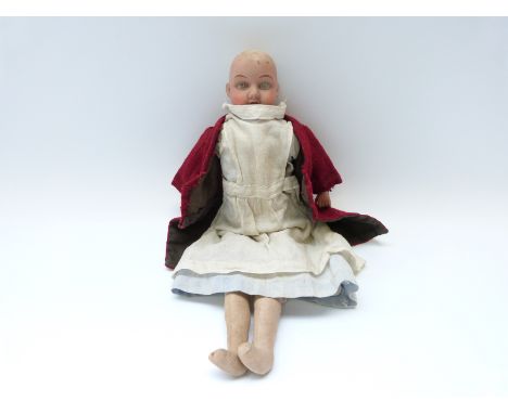 Goss bisque headed doll with closed mouth, fixed blue eyes, soft body and bisque limbs, marked to the back of the neck 'G9 Go