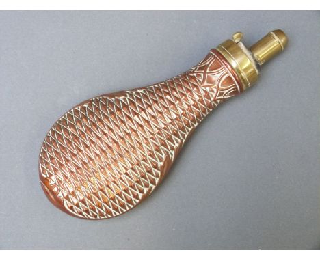 James Dixon & Sons copper and brass powder flask with embossed geometric and acanthus leaf decoration, 20cm long. 