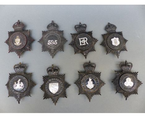 Eight police helmet badges including  Middlesborough, Pembrokeshire, Lincolnshire, Huntingdonshire, Sheffield City etc