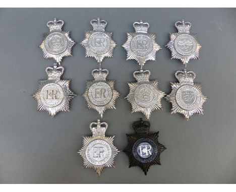 Ten police helmet badges including Notinghamshire Combined Constabulary, Essex and Southend-on-Sea, Cumberland, Westmorland a