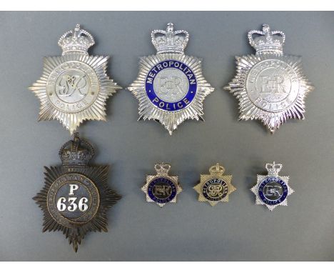 A collection of Metropolitan Police helmet plates and badges