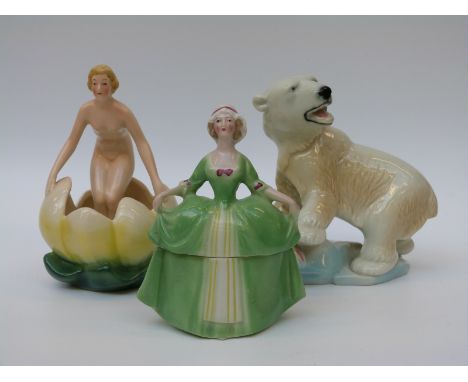 A continental Art Deco nude on a lily, a half-doll trinket and a Wade polar bear