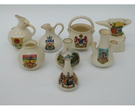 A collection of crested china to include Grafton china cow with Dorchester crest, Goss model of a Celtic urn dug up near Aveb