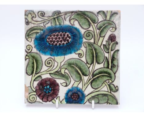 William de Morgan tile with floral decoration on a white ground, maker's mark to back (15.5cm square)