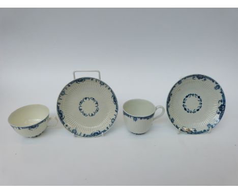Two first period Worcester tea cups and two saucers with open crescent mark to base