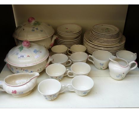 A tea set and part dinner service with tureens in floral design.