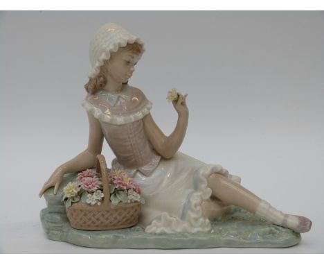 Lladro figurine of a girl with flowers