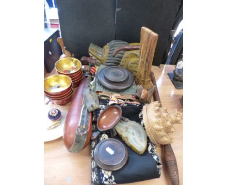 A collection of Eastern and similar wood, shell and beadwork items including a gourd flask, carved lion, waistband, shawl, ri