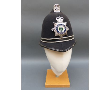 A Thames Valley police helmet and a States of Jersey example