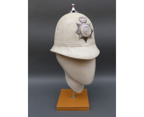 A vintage white Brighton police helmet
