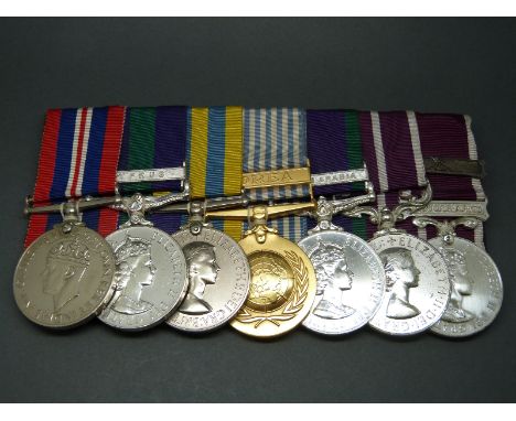 A group of seven medals awarded to 21125661 Sgt J. D Parry RMP comprising 1939-45 medal; Elizabeth II General Service Medal w