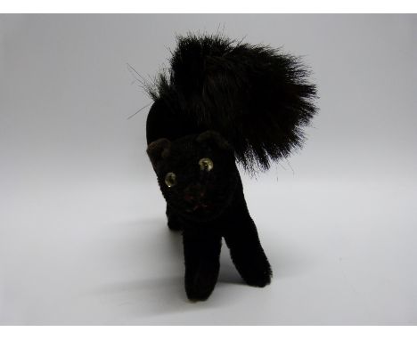 Steiff cat with shaved black mohair and glass eyes, 17cm long