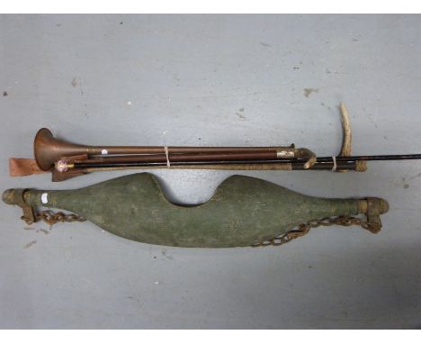 Three vintage riding crops, a walking cane with ceramic top, possibly French and a yoke