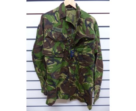 A large quantity of army uniform relating to the Iraq war to include helmet, boots, chemical clothing, cutlery etc.