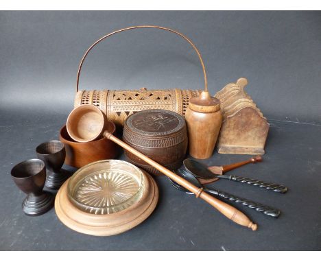 A collection of wooden items to include a c19thC toddy spoon / punch ladle, a wooden shaker, a toast rack and butter dish