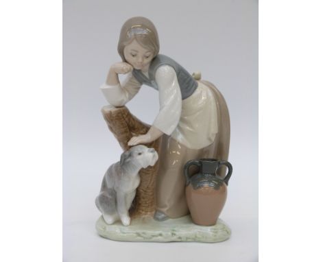 Lladro figurine of a girl petting her dog